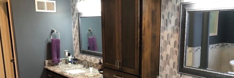 Elegant Kansas City bathroom renovation with frameless shower enclosure and modern freestanding tub by Stag Homes Design Build