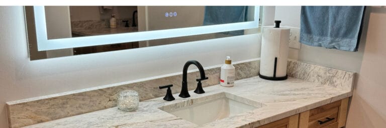 Bathroom sink with mirror in Kansas