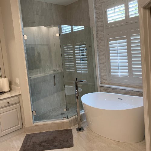 Modern Glass Shower And Freestanding Tub Bathroom Renovation By Stag Homes Design Build In Kansas City Contemporary bathroom renovation with frameless glass shower and freestanding tub by Stag Homes Design Build in Kansas City